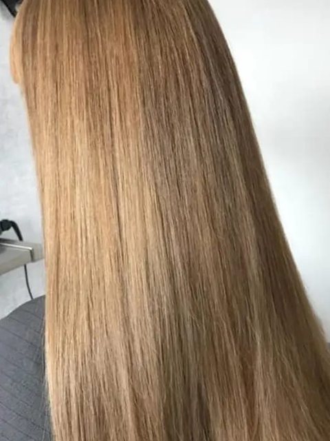 After: long, smooth golden blonde by Homeward Halo hair salon in Radcliffe, Bury