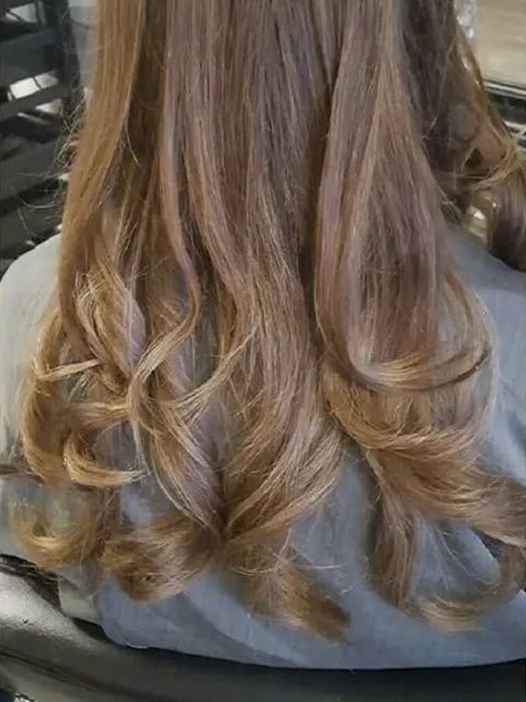 After: long hair with bouncy curled ends by Homeward Halo hair salon in Radcliffe, Bury